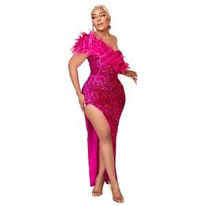 Detail of sequin evening dress with chic feather neckline and high side slit