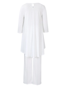 Rear view detail of white long-sleeve top featuring teardrop back button and irregular hem