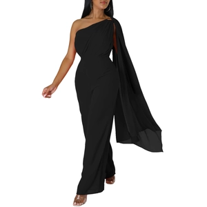 Detail of black one-shoulder jumpsuit featuring a chiffon cape and gold buckle ornament