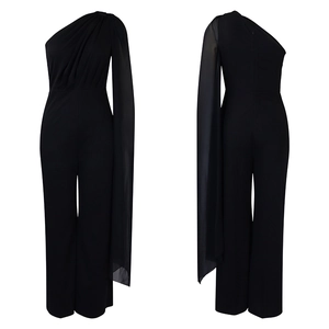 Detailed view of black one-shoulder jumpsuit featuring a flowing cape sleeve and wide legs
