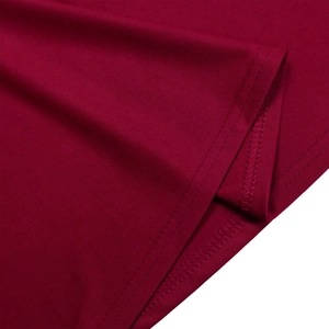 Close-up of wine red knit dress showing high-quality double-needle stitching on the hemline