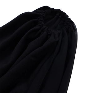 Close-up of gathered elastic waist detail on elegant black one-shoulder jumpsuit