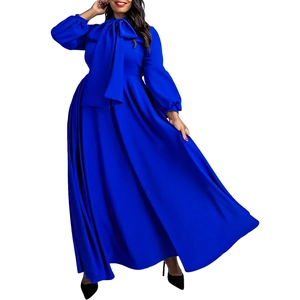 Detail of royal blue maxi dress featuring elegant puff sleeves and a large bow neckline