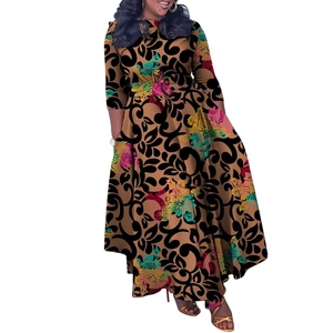 Detail of elegant floral print dress with waist tie and African style patterns