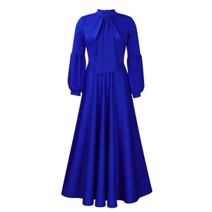 Detail of royal blue maxi dress with tie-neck bow and elegant lantern sleeve texture