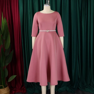 Detail of elegant solid color A-line evening dress with pearl belt and 3/4 sleeves