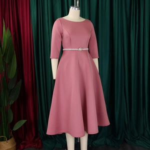 Detail view of pink evening dress with pearl rhinestone belt and A-line skirt