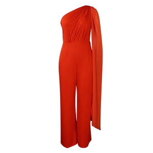 Detail view of red one-shoulder jumpsuit with floor-length cape sleeve and wide-leg trousers