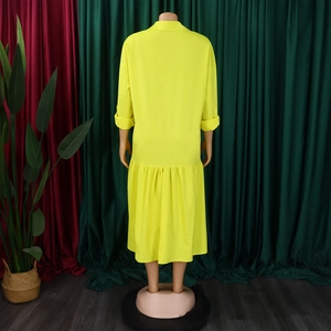 Back view of loose fit neon yellow shirt dress with pleated hem and classic collar