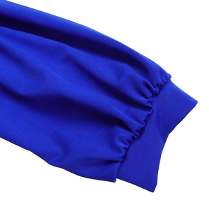Detail view of royal blue puff sleeve cuffs with elastic ribbed texture and stitching