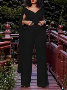 Combinaison pantalon large noire pour femme avec col en V et manches cape longues