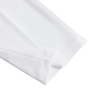 Close-up detail of premium white fabric texture and precision stitching on the jumpsuit cuff