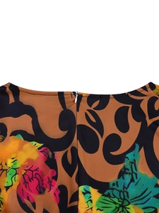 Detailed close-up of earth brown floral dress with hidden white zipper and neat stitching