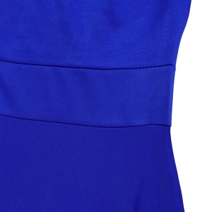 Detail of the elastic pleated high waist and royal blue fabric on the long dress