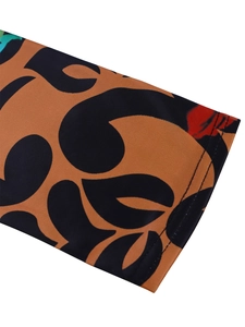 Detailed close-up of elegant leopard print fabric with precise double-needle stitching