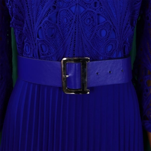 Detail of royal blue lace crochet dress with pleated skirt and metallic D-buckle belt