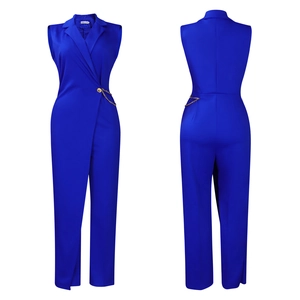 Detail view of sapphire blue sleeveless jumpsuit with gold chain belt and suit collar