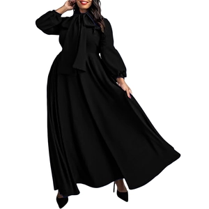 Detail of elegant black maxi dress with pussy-bow neck and puffy lantern sleeves