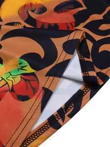 Macro detail of elastic floral fabric with orange abstract patterns and double-needle stitching