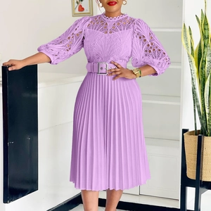 Detailed lace embroidery and pleated skirt texture of this elegant purple dress