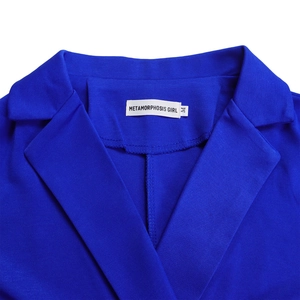 Detail of royal blue jumpsuit collar with professional stitching and size M brand label
