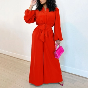 Detail of red lantern sleeves and high waist drawstring on casual wide-leg jumpsuit