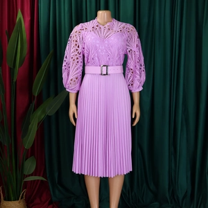 Detailed embroidery and pleated lavender dress with long puff sleeves and a buckle belt