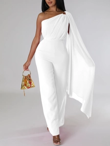 Elegant white one-shoulder jumpsuit with a long cape and gold metallic handbag