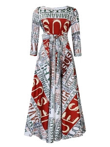 Close-up of elegant A-line dress with religious graffiti print and waist tie belt