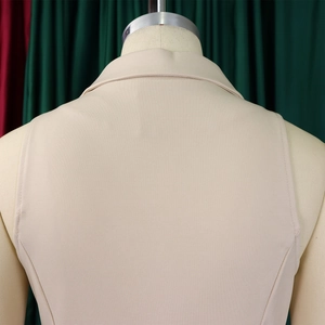 Detail view of the back of a beige lapel sleeveless jumpsuit with fine fabric texture
