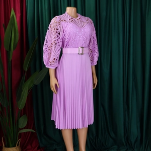 Detailed view of lavender lace hollow patterns and pleated skirt with matching belt