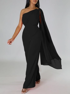 Elegant black one-shoulder wide-leg jumpsuit with dramatic shoulder fringe detail