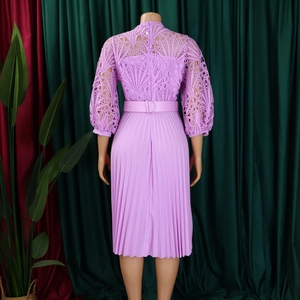 Detail of lavender lace hollow floral bodice and pleated hem with matching belt