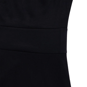 Detail shot of black high-waisted dress showing fine stitching and smooth fabric texture
