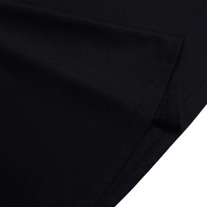 Macro view of high-quality black knit fabric showing precise double-stitch sewing details