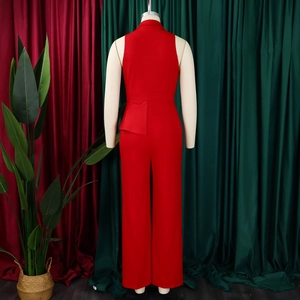 Rear view of deep red sleeveless jumpsuit with asymmetric ruffle detail and straight leg cut