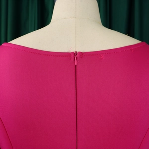 Detailed view of the invisible back zipper on this rose pink evening dress