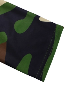 Macro detail of camouflage print fabric with durable double-needle stitching on edges