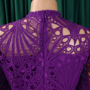 Detail of deep purple lace dress with back invisible zipper and hollow geometric patterns