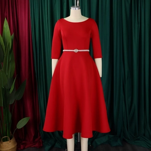 Detail view of red elegant evening dress with pearl belt and full A-line skirt