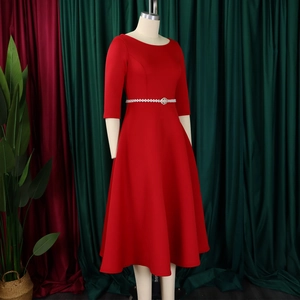 Detail view of red midi dress with sparkling pearl and rhinestone waist belt decoration