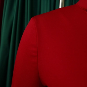 Close-up of red top shoulder line and neckline with structured fine-textured elastic fabric