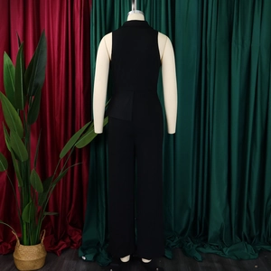 Detail view of the elegant back design on a black sleeveless wide leg jumpsuit