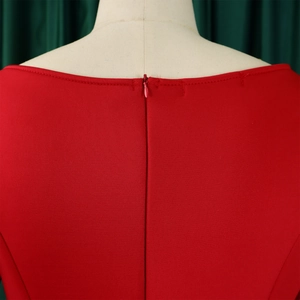 Detail of red evening dress showing the back invisible zipper and stitching on plain fabric