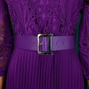 Detailed view of purple lace crochet bodice with pleats and a silver buckle waist belt