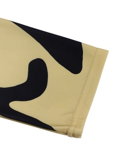 Detailed close-up showing the high-quality double-needle stitching on khaki leopard print fabric