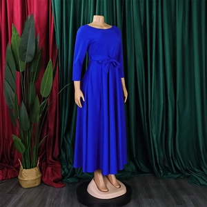 Detail of royal blue maxi dress featuring a cinched waist tie and elegant A-line skirt flow