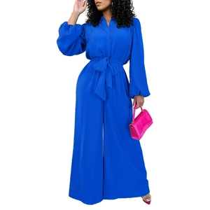 Detail of royal blue jumpsuit showing shirt collar and texture of the chiffon fabric