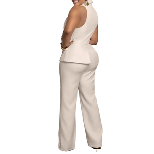 Detail of elegant beige sleeveless peplum top and high-waisted wide-leg trousers set