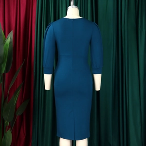 Detail view of the back of a slim fit midi dress with hidden zipper and puff sleeves